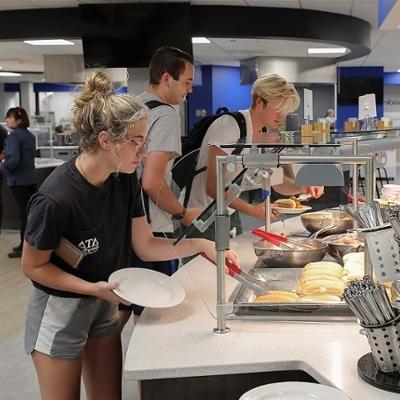 Students eating at the main dining hall the Graze
